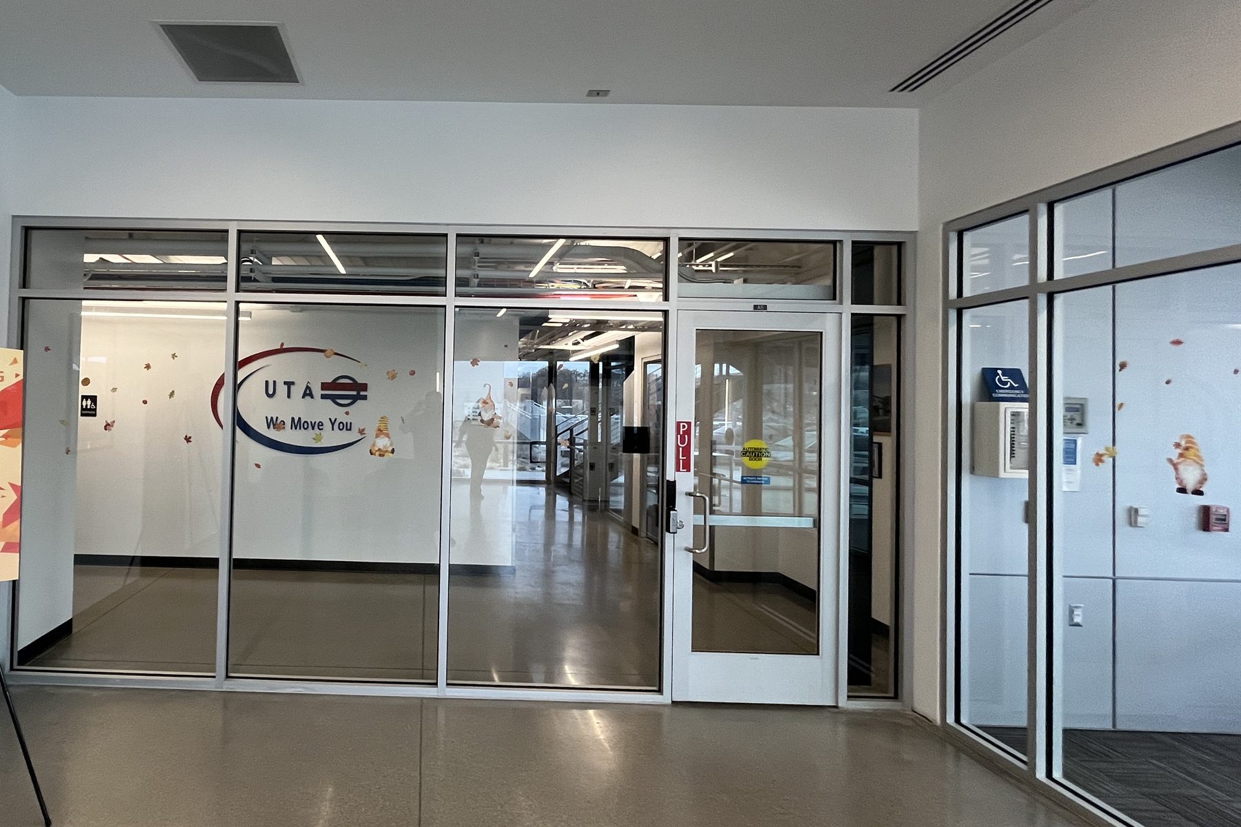 Large commercial interior glass partition with privacy film